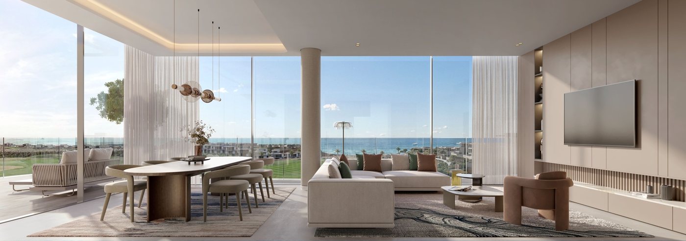 Living room with floor-to-ceiling windows facing the sea